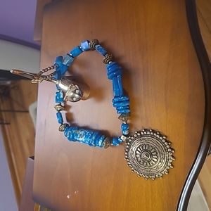 Necklace with metal pendant